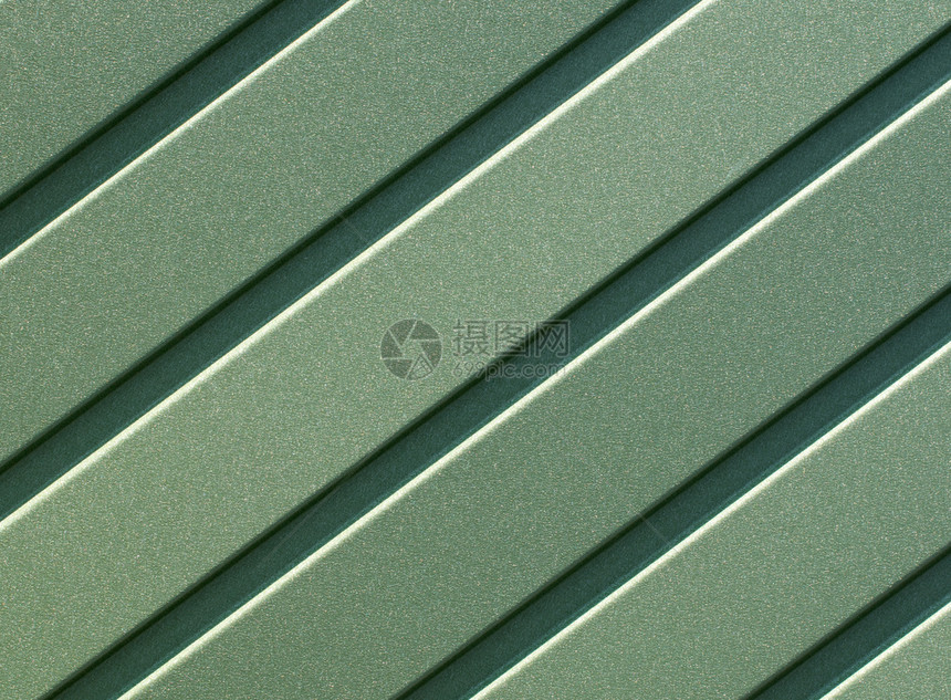 质地盘子结构体绿色金属栅栏由用垂直制针钢板和导的钢板成绿色铁背景涂料紧闭绿色制铜板和垂直导图片