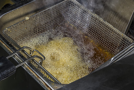 工作烤箱垃圾土豆薯油炸条和煮概念快餐厅厨房设备图片