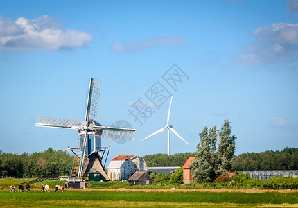 生态活力乡村的荷兰老式风车和现代力涡轮机荷兰的老式风车和现代力涡轮机图片