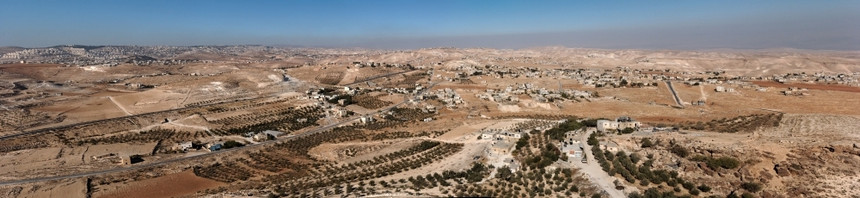 圣经尘土飞扬伯利恒附近希律王周围沙漠中的阿拉伯村庄利恒附近希律王周围沙漠中的阿拉伯村庄宽图片