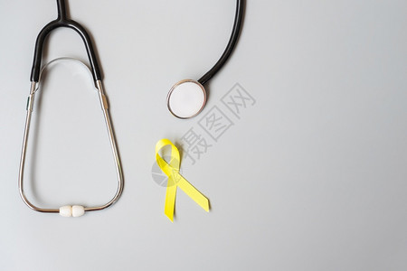 黄色丝带与听诊器图片