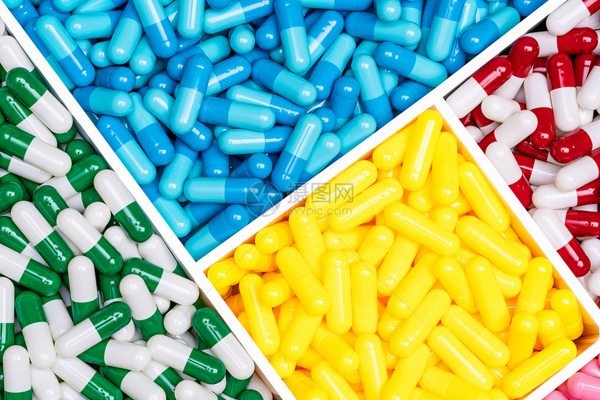 制造业塑料箱中最有彩色的抗生素胶囊药丸塑料盒中的富多彩抗生素胶片药概念选择物治疗传染病多于医的图片