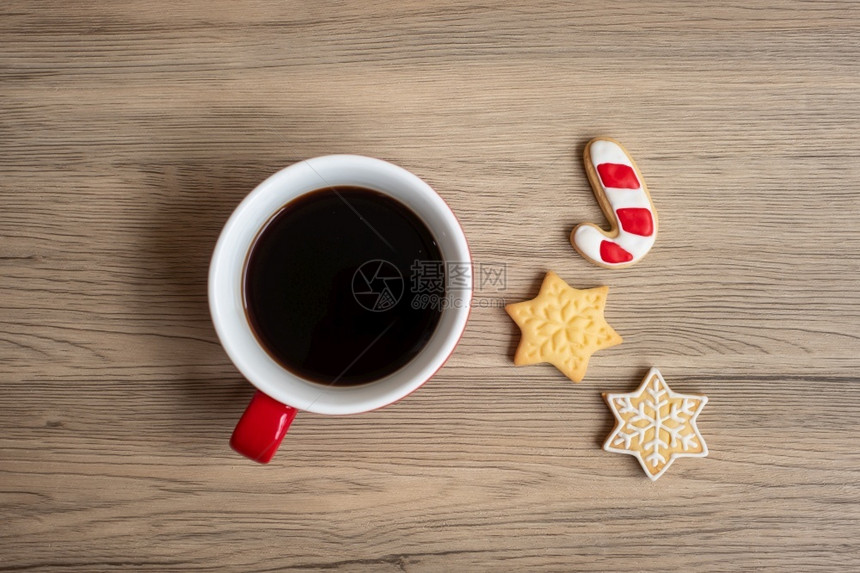 刨冰棕色的雪圣诞快乐有自制饼干和咖啡杯在木桌背景的圣诞晚会派对节假日和新年快乐概念图片