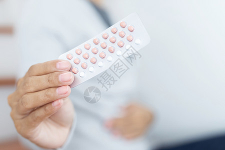 排卵防止成人后使用的避孕药丸背景图片