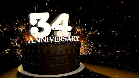 肃纪白色的爆炸周年纪念34卡圆形巧克力蛋糕装饰着蓝色红黄绿的糖衣杏仁木桌上有白色数字背景是人造火星和彩色糖衣落在桌子上3D插图周年纪设计图片