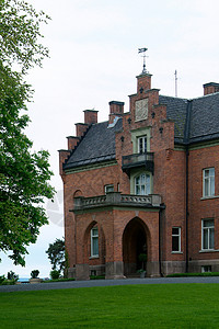 挪威的豪宅庄园财产建筑学公园红色房子绿色草地建筑背景图片