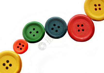 按钮键红色绿色黄色橙子缝纫静物蓝色背景图片