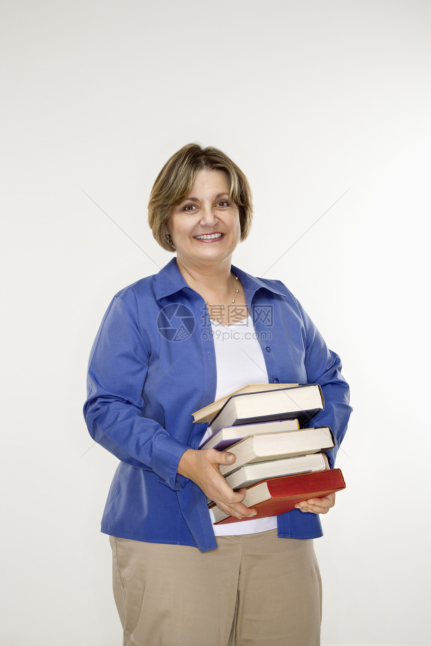 拿着书的女人闲暇妇女女性女士阅读工作中年微笑成年知识图片