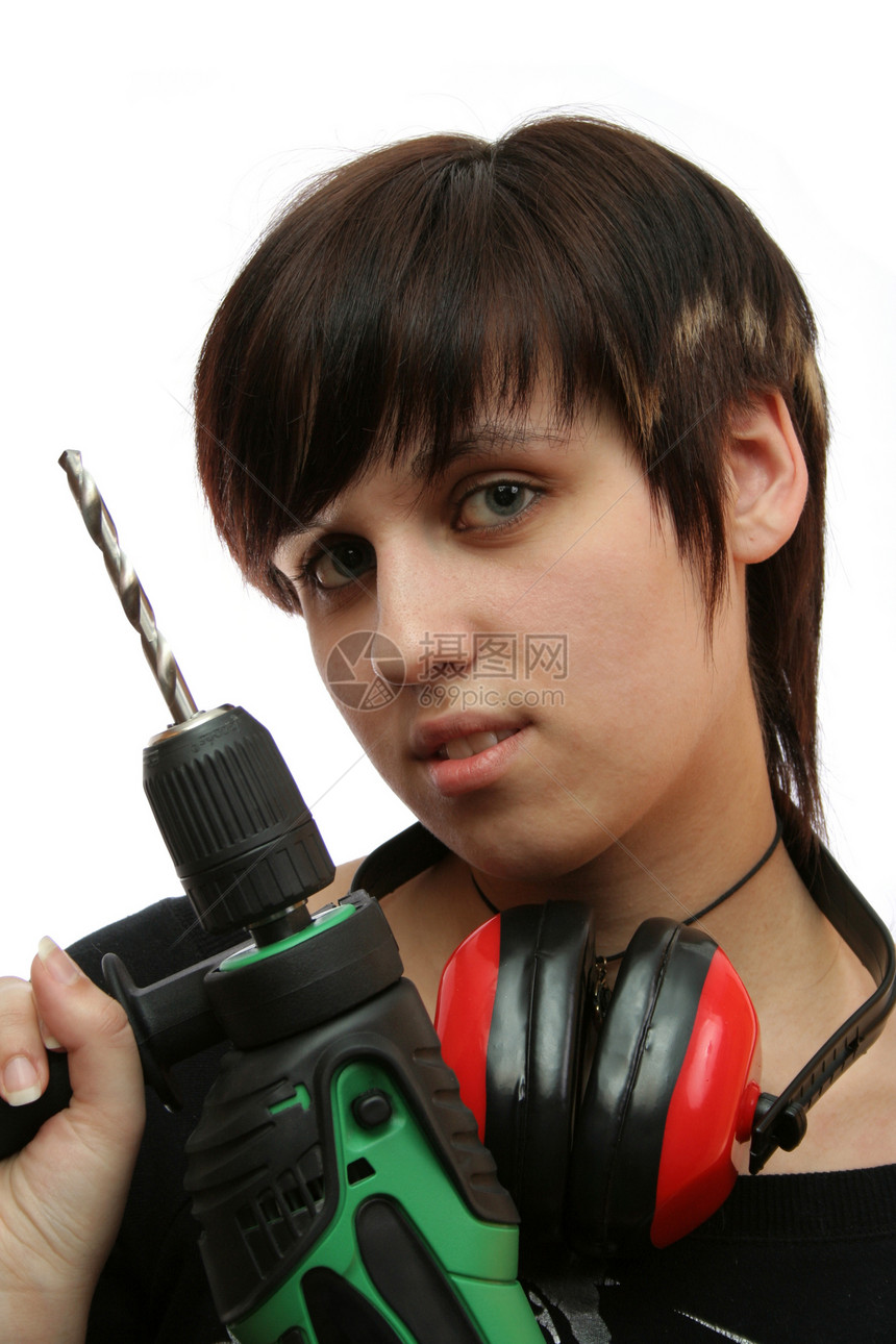 带耳机和建筑钻井的年轻女孩人像职业成人劳动女士工具工作修理工头发女性图片