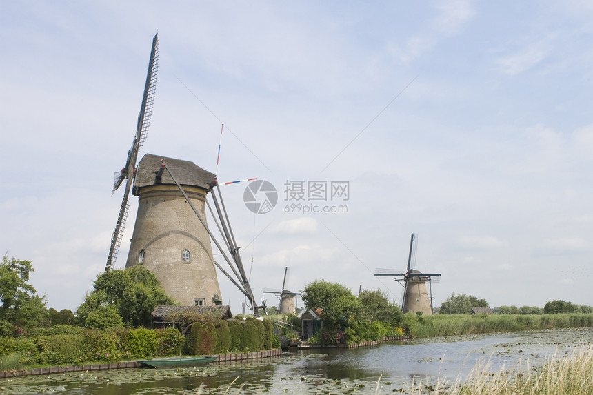 荷兰风车和运河农业旅游堤防旅行小孩图片