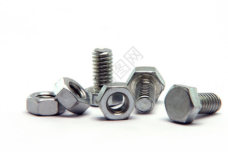 螺钉和螺栓紧固件线圈金属螺丝灰色连接器维修硬件宏观工具背景图片