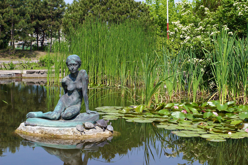 妇 女芦苇地荷花雕像雕塑旅游公园盛会植物群阳光绿色图片