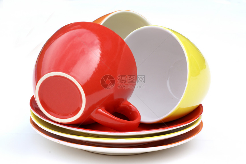 杯子和酱汁橙子勺子飞碟茶具碟子黄色红色白色宏观咖啡图片