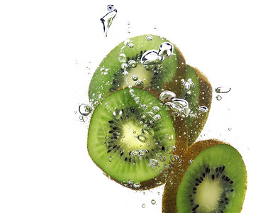 kiwi 飞水果汁飞溅水果气泡背景图片