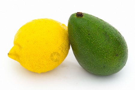 黄柠檬和绿鳄梨背景图片
