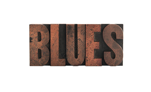 字体印刷木型的蓝色背景图片