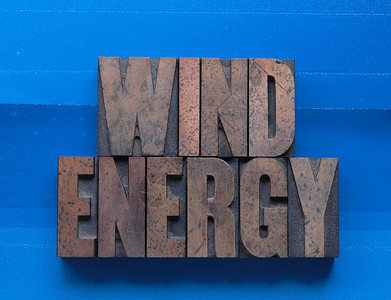 风能字母凸版生态环境大写字母木头墨染电源蓝色背景图片