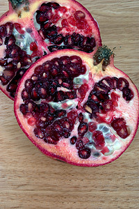 打开红色食物水果石榴种子背景图片