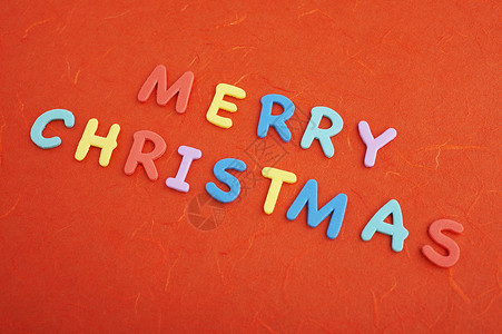 圣诞快乐字体橡皮红色塑料背景图片