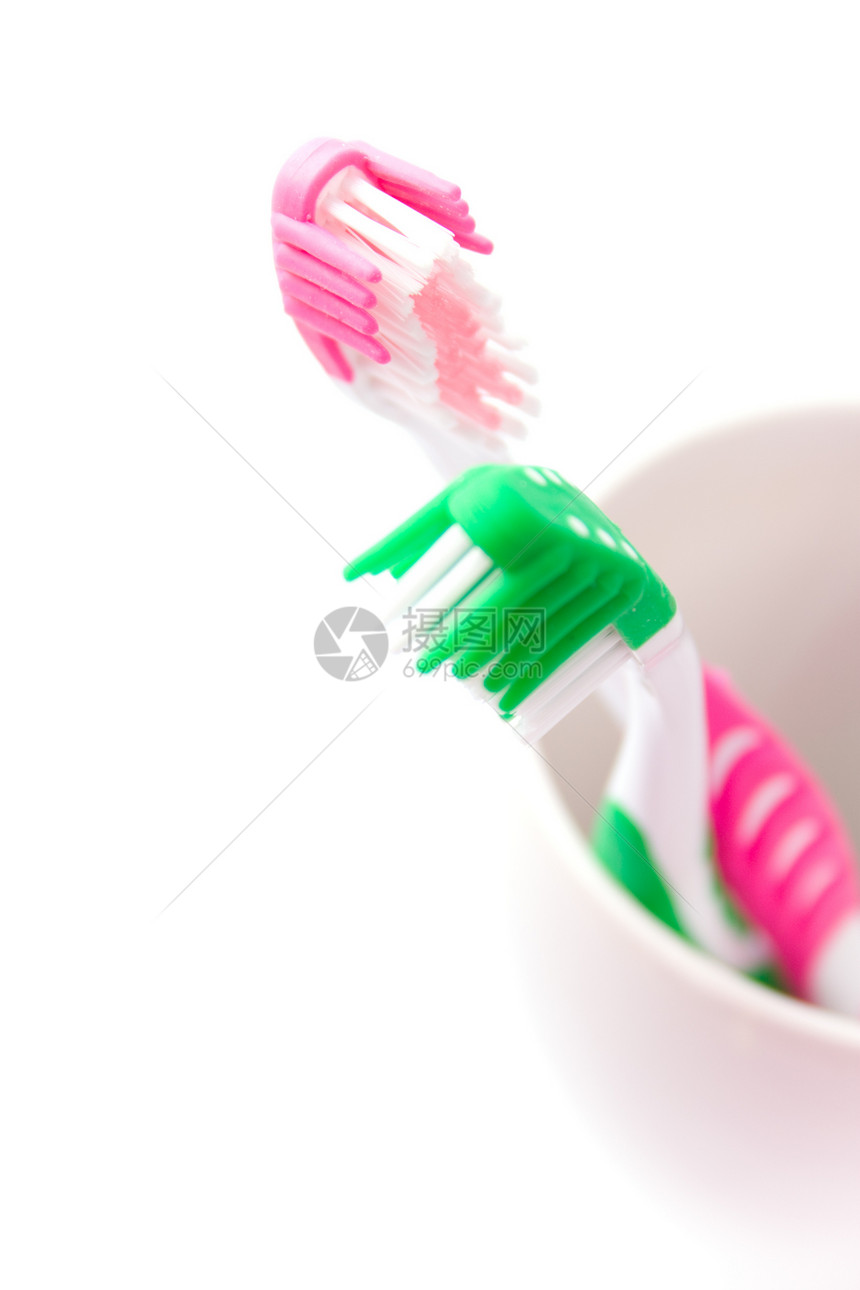 2个牙刷牙膏宏观红色陶瓷刷子卫生绿色牙医抛光浴室图片