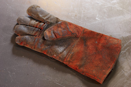 手套皮革工作工匠润滑脂作坊劳动工人工具精神棕榈背景图片