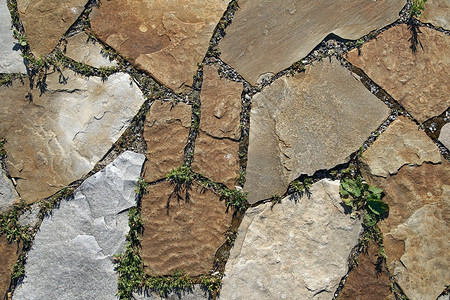 铺石纹理石板石头路面石方砂岩鹅卵石铺路瓷砖背景图片