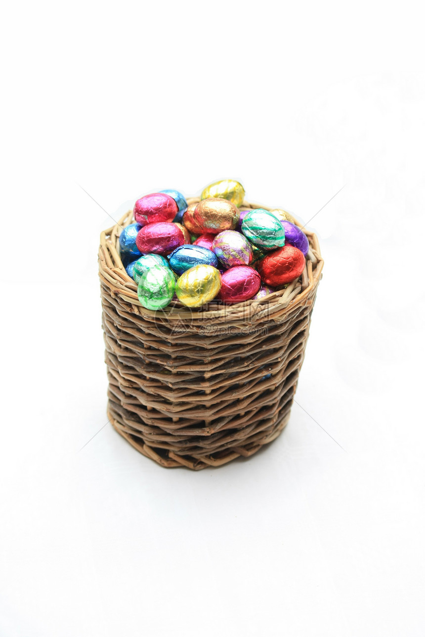 配巧克力蛋的韦克篮子团体蓝色绿色礼物庆典食物糖果金子图片