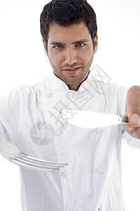 男性厨师拿着餐具的肖像背景图片