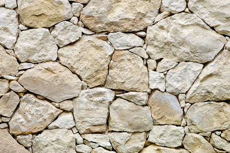 岩石墙石头建筑建造石灰石石墙砌体背景图片