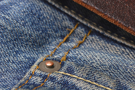 零碎的让斯特罗线程仔裤金属按钮传统腰带靛青质量长裤棕色背景图片