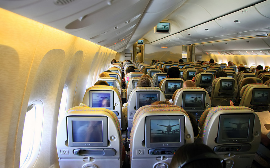 内装飞机蓝色航班白色民众架子天空车辆座位运输游客图片