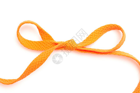 弓下蕾丝鞋类橙子领带背景图片