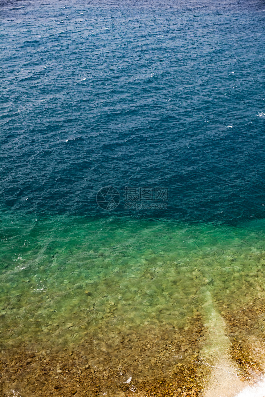 海洋背景岩石旅行海岸线支撑石头热带蓝色假期海浪海滩图片