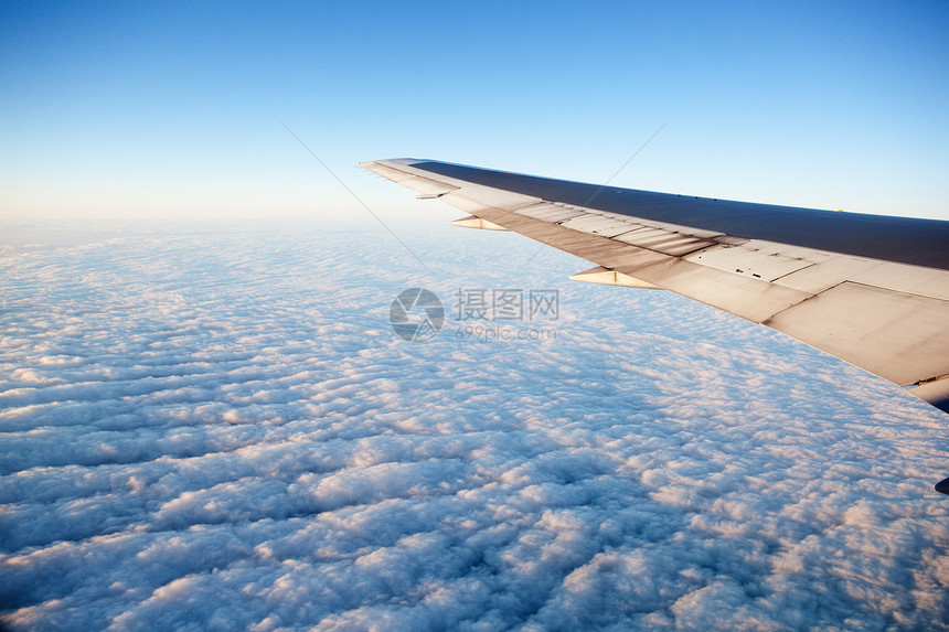 机翼飞机喷射飞行蓝色航空航班翅膀运输旅行天空日落图片