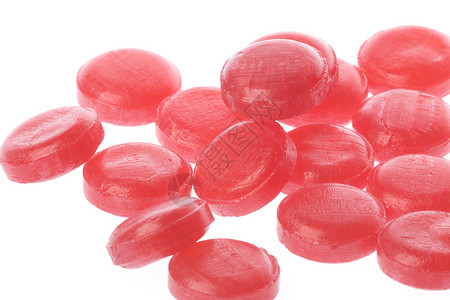 孤立的大枣糖果粉色食物刺激红色宏观糖衣背景图片
