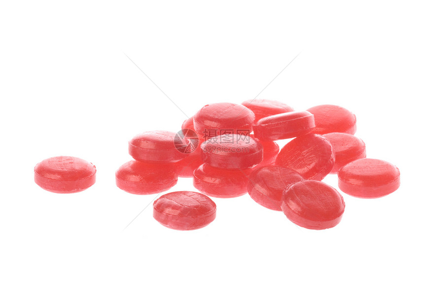孤立的粉色大枣红色糖果刺激糖衣宏观食物图片