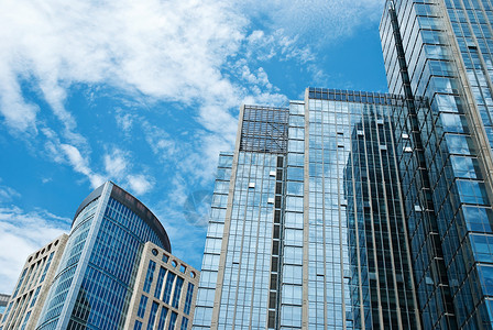 市商业区商圈建筑学城市建筑物现代化玻璃墙市中心玻璃钢白云背景图片