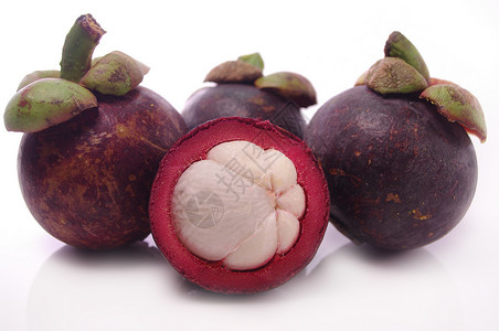 芒果山竹白色水果食物紫色背景图片