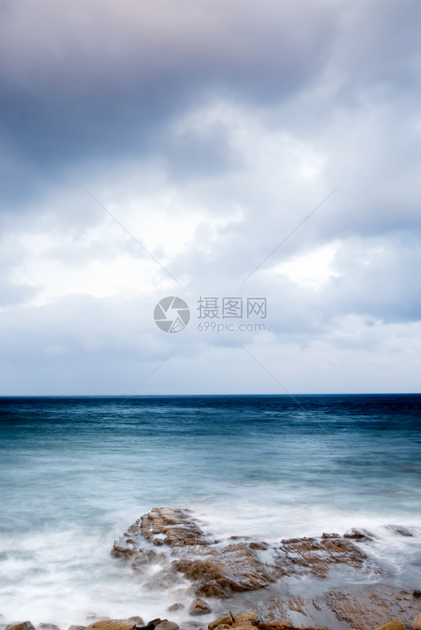 珊瑚礁海岸线的日落海景支撑海岸日出岩石太阳海浪晴天石头海洋图片