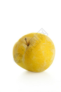 白色背景的黄色米拉铃食物石头淡黄色食品李子照片水果背景图片