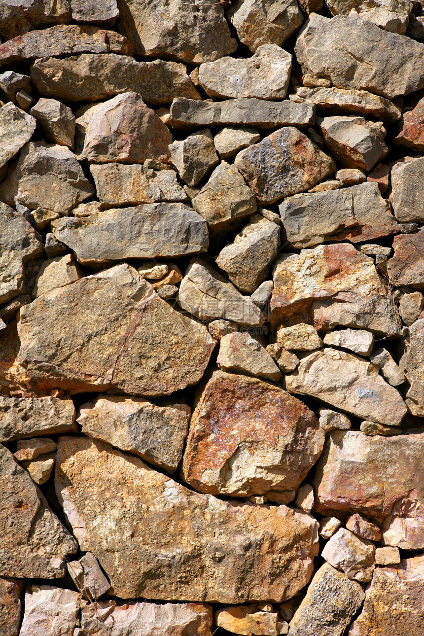 西班牙的共济会 旧石墙水泥房子城堡岩石裂缝材料墙纸城市建筑学砂浆图片