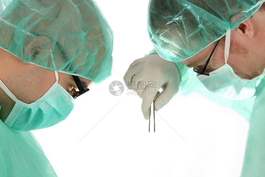 两名外科医生在工作男人疾病顾问药品操作考试诊所援助治疗职业图片