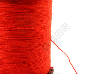 串线的红展开红色缝纫宏观纤维细绳裁缝维修背景图片