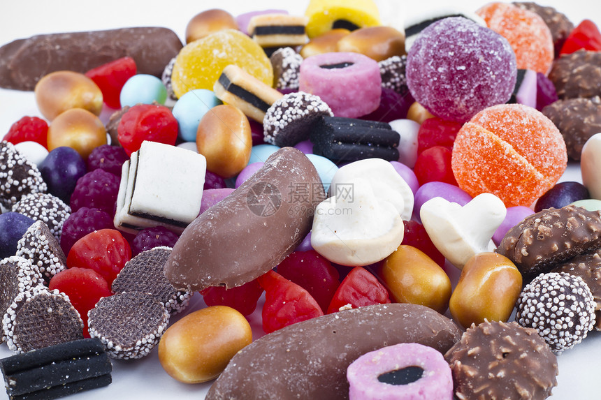 白背景的糖果山果味多样性食物欢乐派对催肥乐趣牙龈巧克力幸福图片