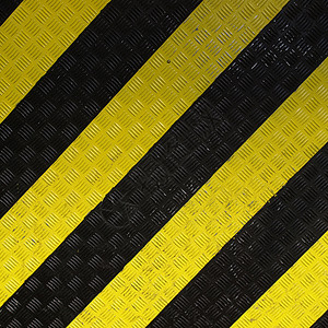钻石钢床单工业黑色材料黄色条纹金属灰色背景图片