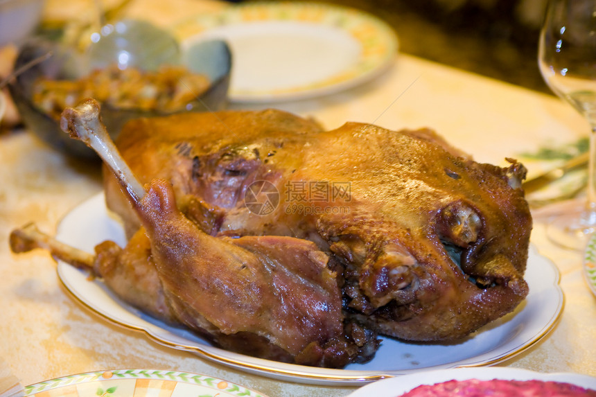 烤鹅 新年一顿丰盛的饭文化家禽白色金子盘子茶点菜单褐色食物鸭子图片