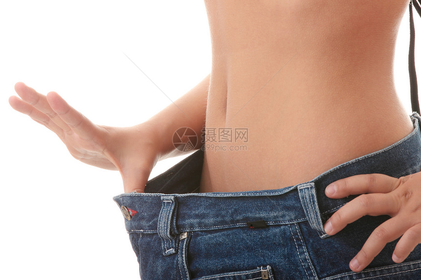 女性变得瘦瘦 穿旧牛仔裤女士组织橘皮腹部蓝色数字测量损失营养肥胖图片