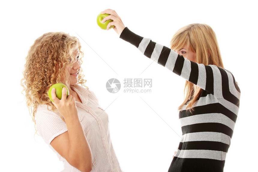两个吃绿苹果的十几女友快乐学生友谊女孩们微笑教育朋友闺蜜金发朋友们图片