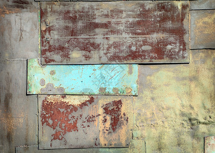 墙上布满生锈的旧钢底板背景图片