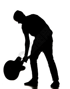 一个人打他的吉他时的脚影岩石工作室明星音乐摇滚乐器静物原声背景图片